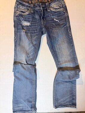 Rock Revival Women’s Faded Blue Straight Jeans with Distressed Accents